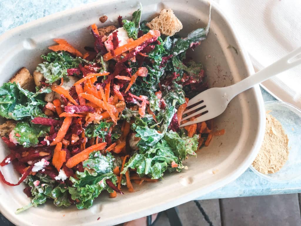 A salad in a compostable container.