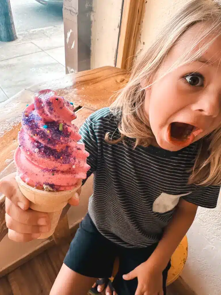 A boy with a colorful ice cream cone from Makanis Magical Ice Cream Shack in Hilo on the Big Island. 