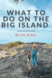 A graphic that reads "What to do on the big island with kids" on a photo of a mom and son holding hands on lava rock on the Big Island of Hawaii. 