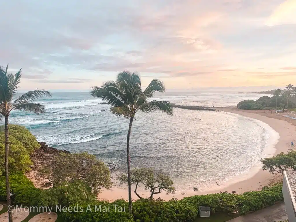 A beautiful coastal sunrise on the North Shore of Oahu, with an expansive view of Kuilima Cove at Turtle Bay Resort. 