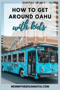 A graphic that reads "How to get around Oahu with Kids" overlayed on a photo of a colorful Trolley in Waikiki, Oahu. 