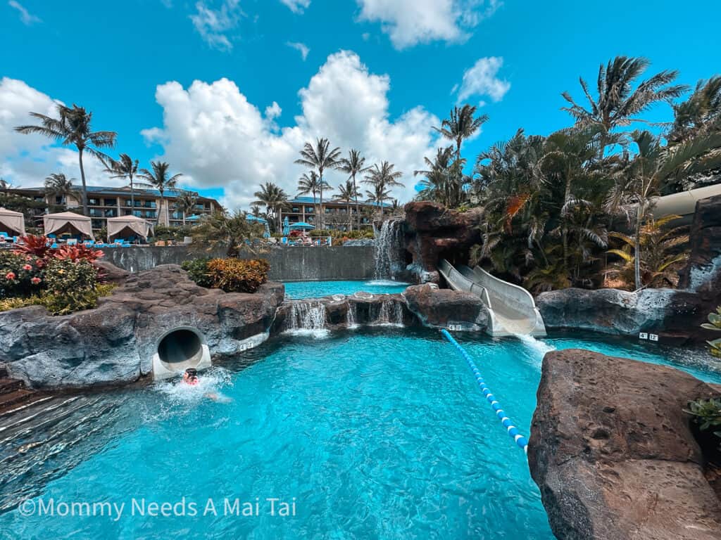 Multilevel view of waterslides and resort pool at Koloa Landing Resort on Kauai. 